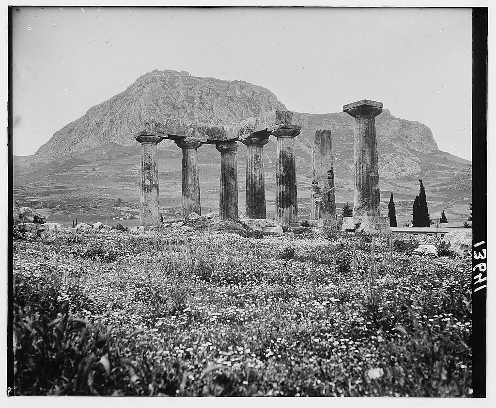 Old Corinth. Ruins of old Corinth. The Temple of Apollo. Agora Corinth in background. Temples on distant hilltop