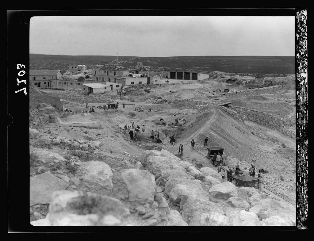 Tel Deweir (Lachish). Camp buildings at Tell. Workers clearing area below flanking wall